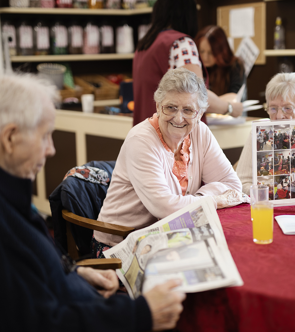 senior people enjoying the company around a table